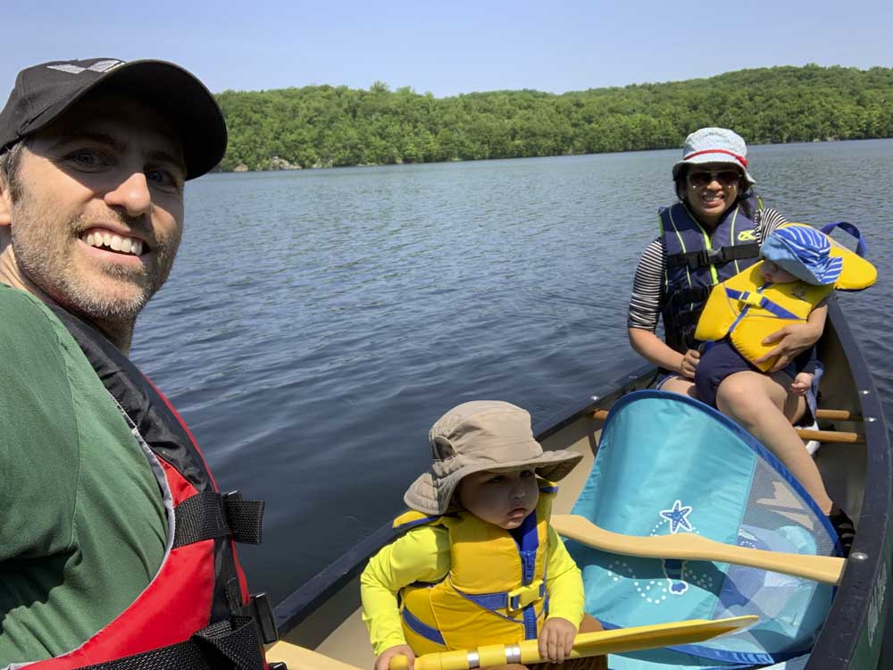 dr. david lepelletier of Lafayette Dental in Lafayette, NJ with family on boat on lake