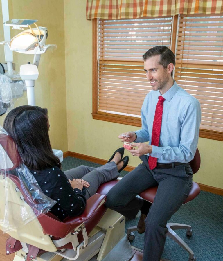dr. david lepelletier of Lafayette Dental in Lafayette, NJ talking to patient in dental chair